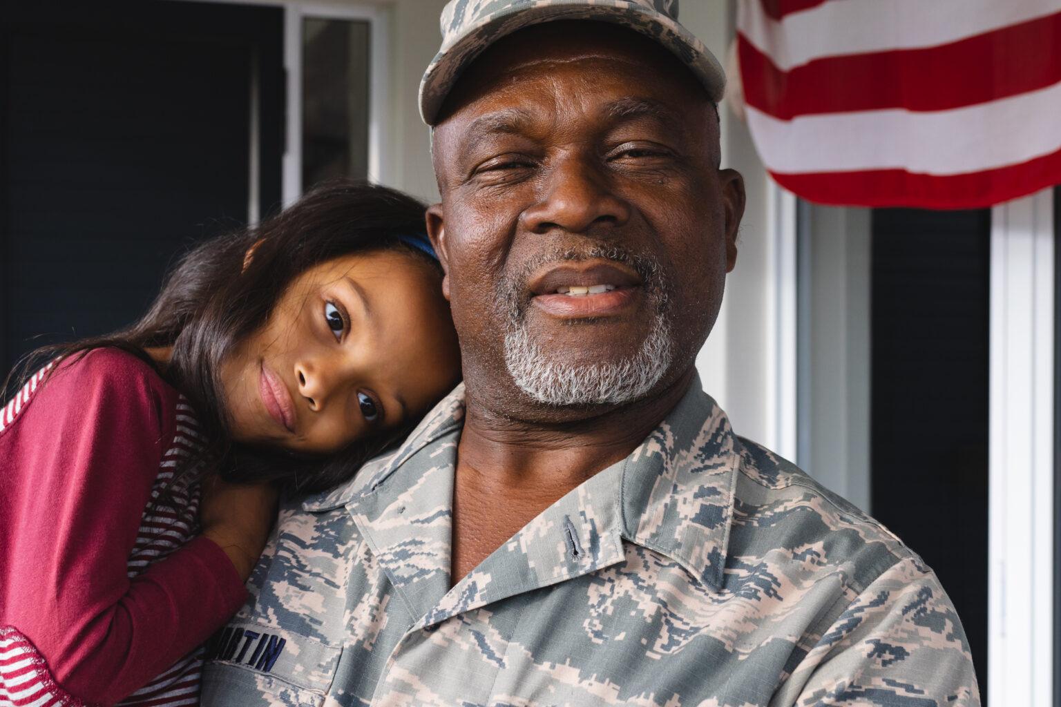 Portrait of African American Military Senior man with child